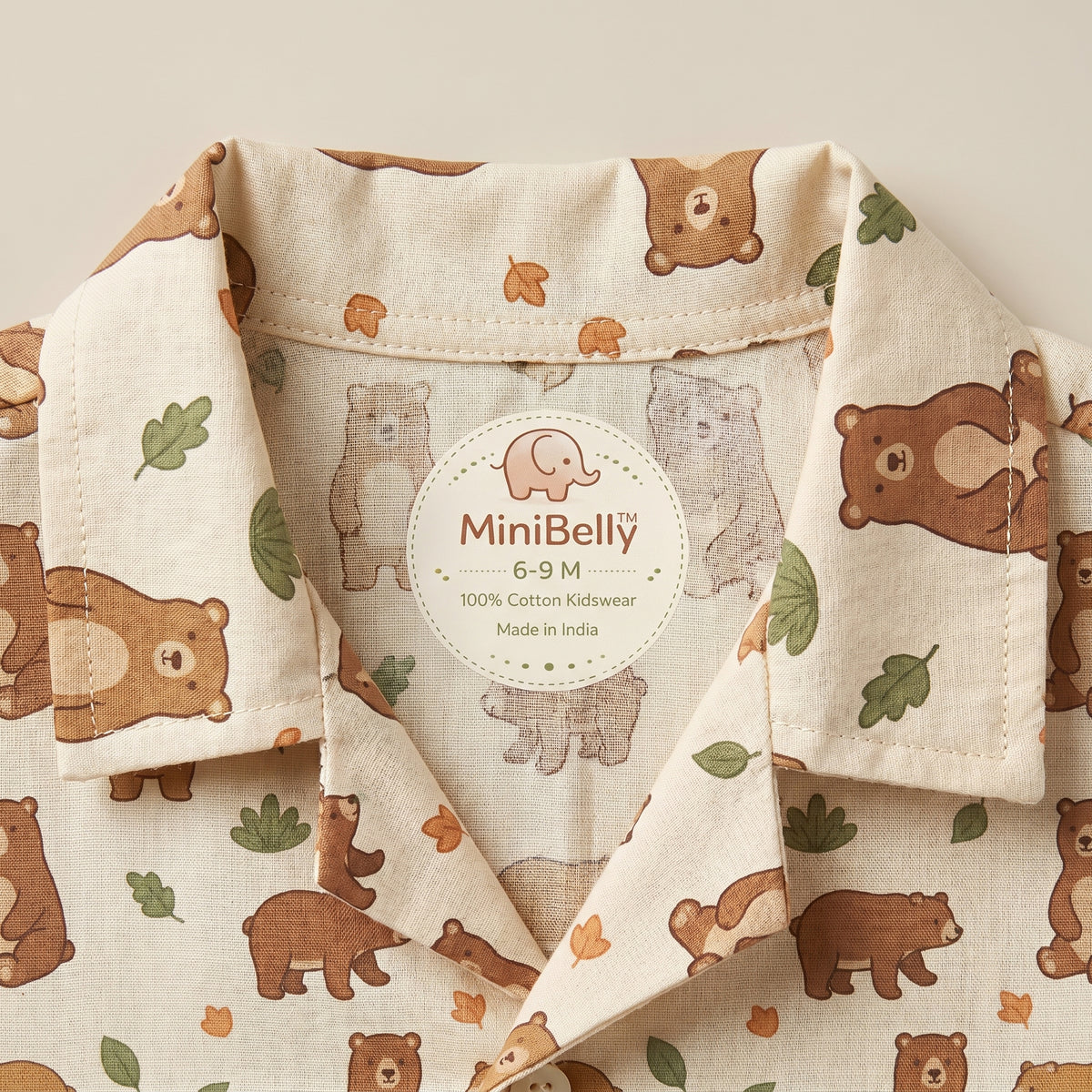 MiniBelly kids' co-ord set with half shirt and pants featuring cute brown bears and green leaves on light cotton fabric.