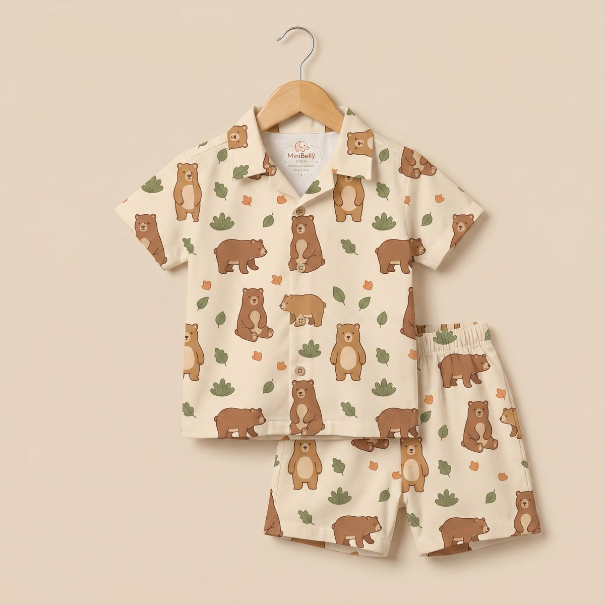 MiniBelly kids' co-ord set with half shirt and pants featuring cute brown bears and green leaves on light fabric.
