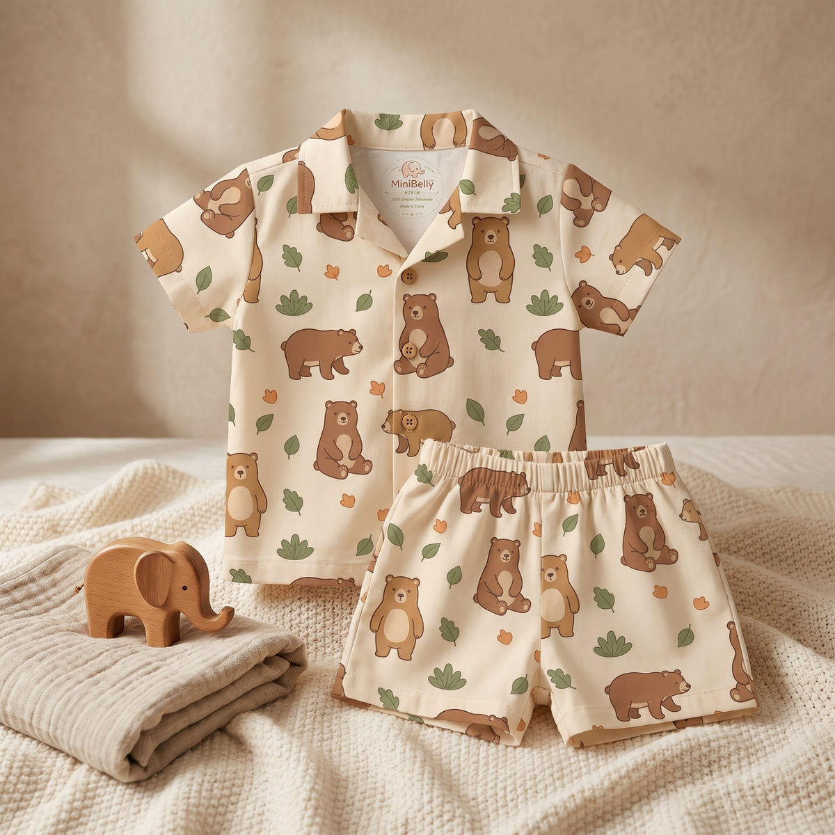 MiniBelly kids' co-ord set with half shirt and pants featuring cute brown bears and green leaves on light fabric, made of 100% cotton.