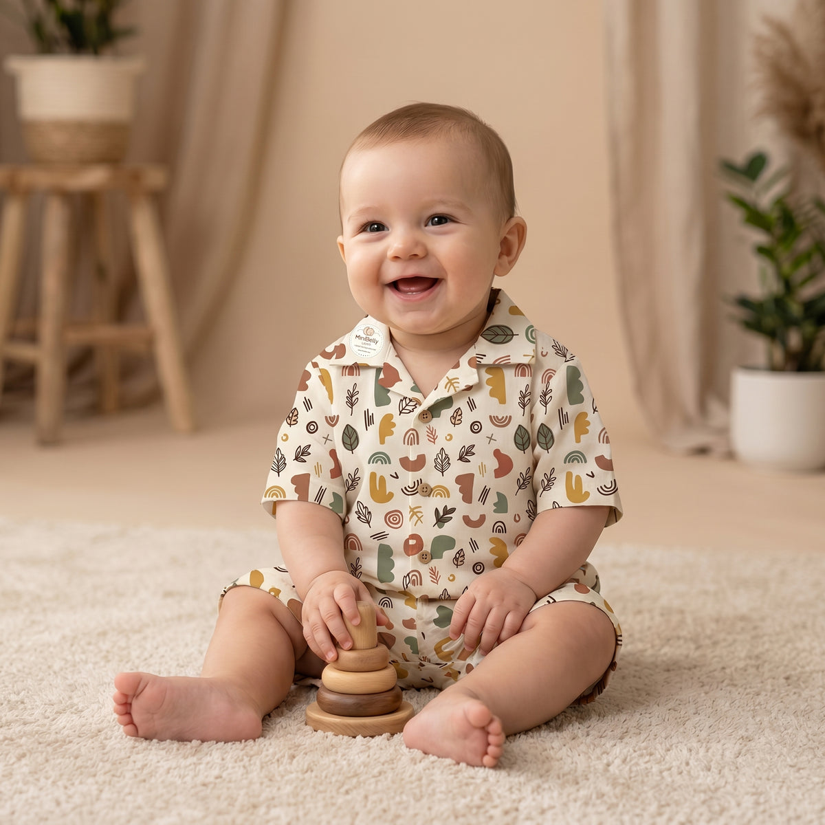 MiniBelly kids' half shirt and pant co-ord set with abstract shapes and leaves in earthy tones, made of soft 100% cotton fabric.