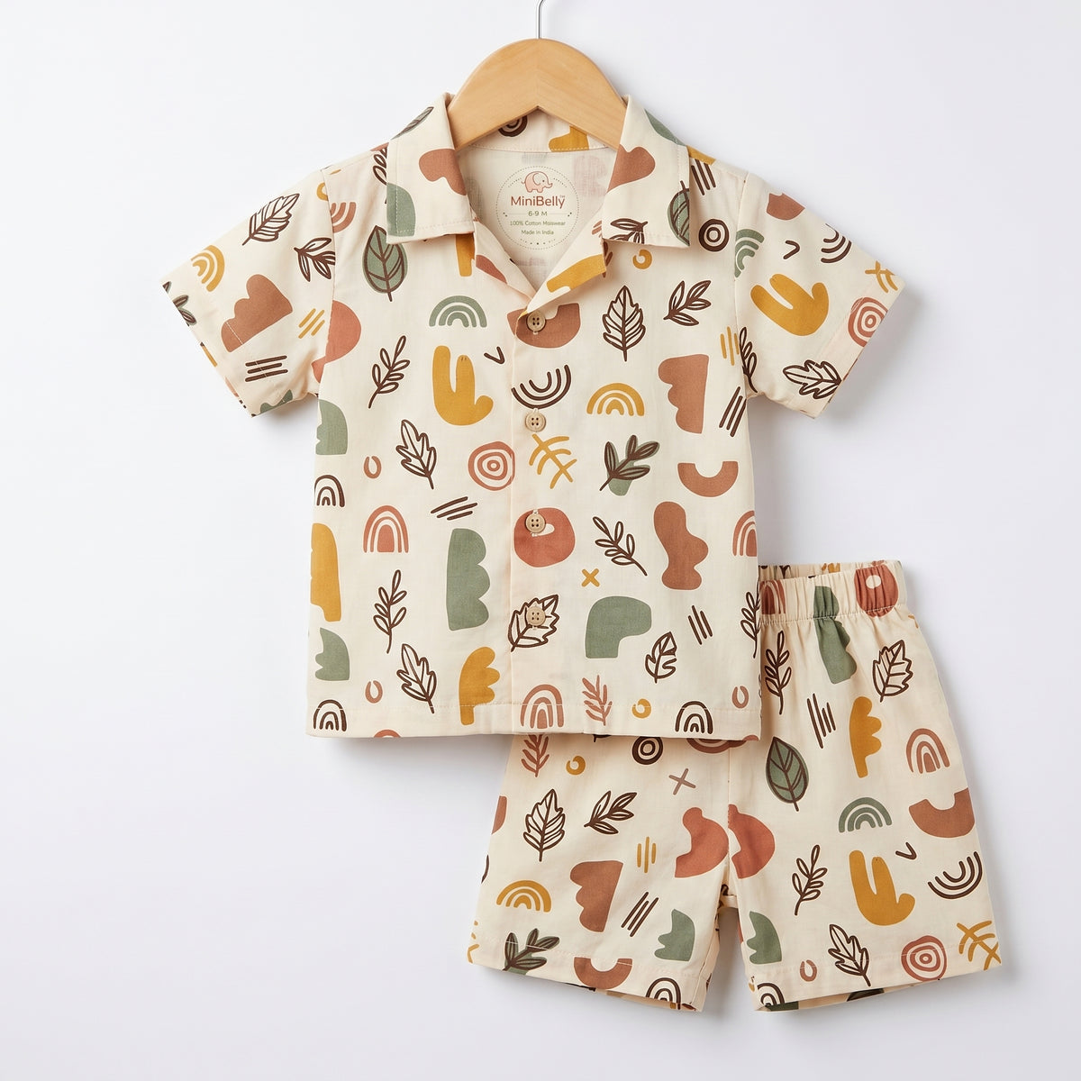 MiniBelly kids' co-ord set with half shirt and pants in abstract shapes and leaves, made of soft 100% cotton in earthy tones.