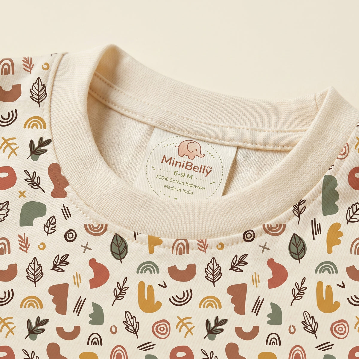 MiniBelly kids' half shirt and pants co-ord set with abstract shapes and leaves in earthy tones, made from soft 100% cotton.
