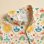 MiniBelly kids' cream kurta pajama set with soft striped fabric, featuring Diwali diyas, suns, rainbows, and stars doodle pattern.