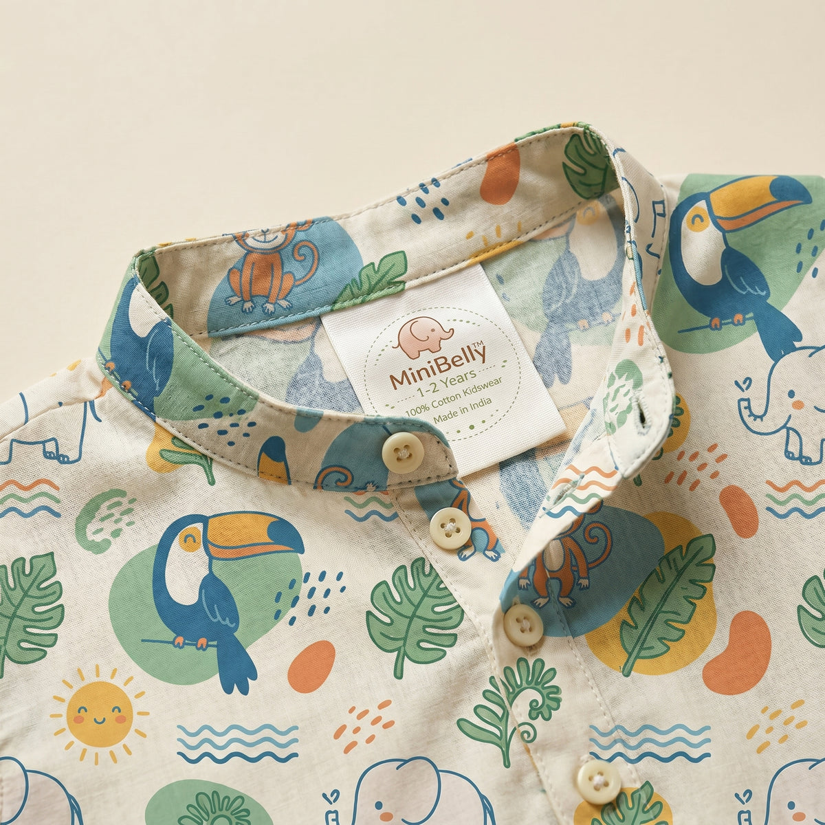 MiniBelly kids' cotton kurta pajama set with cute jungle animals, leaves, and suns, featuring soft cream fabric and striped design.