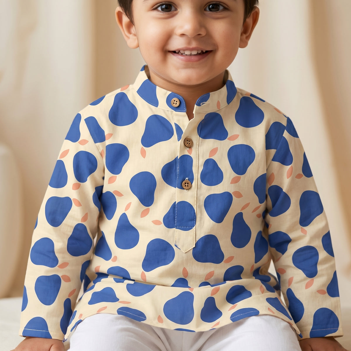 MiniBelly kids' kurta pajama set with abstract blue pear pattern on light background, made from soft 100% cotton fabric.