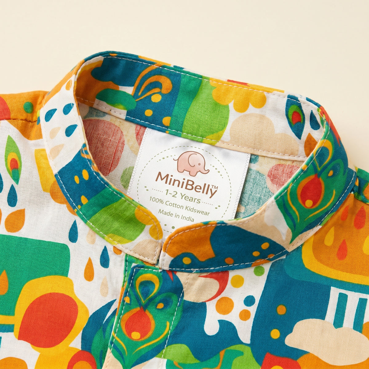 MiniBelly kids' kurta pajama set in soft cotton with abstract floral, clouds, and raindrop motifs in cream for ages 0-2 years.