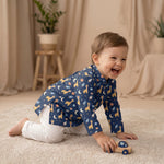 MiniBelly kids' cotton kurta pajama set with cute cartoon astronaut giraffes, rockets, and planets in soft cream stripes.