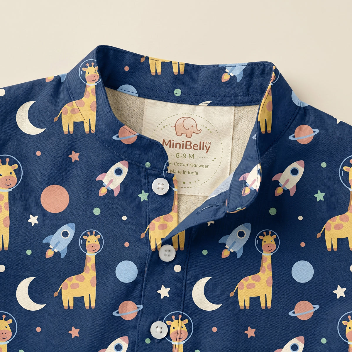 MiniBelly kids' cotton kurta pajama set with cute cartoon astronaut giraffes, space rockets, and planets in soft cream stripes.