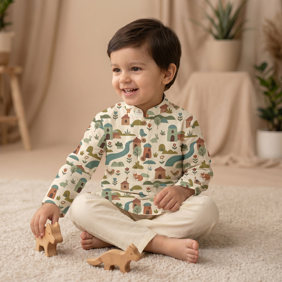 MiniBelly kids' cotton kurta pajama set with whimsical woodland village print featuring animals and houses in soft cream stripes.
