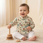 MiniBelly kids' cream cotton kurta pajama set with soft stripe fabric featuring whimsical woodland village with animals and houses.