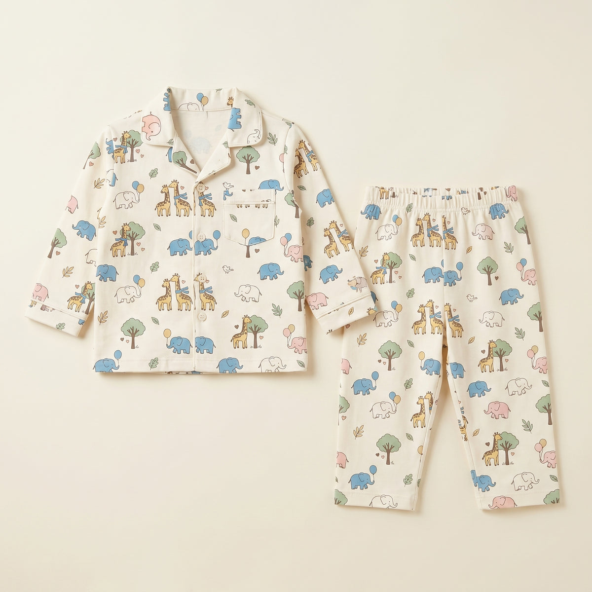 MiniBelly kids' night suit with cute cartoon elephants, giraffes, balloons, and trees in a cream cotton fabric for ages 0-12 months.