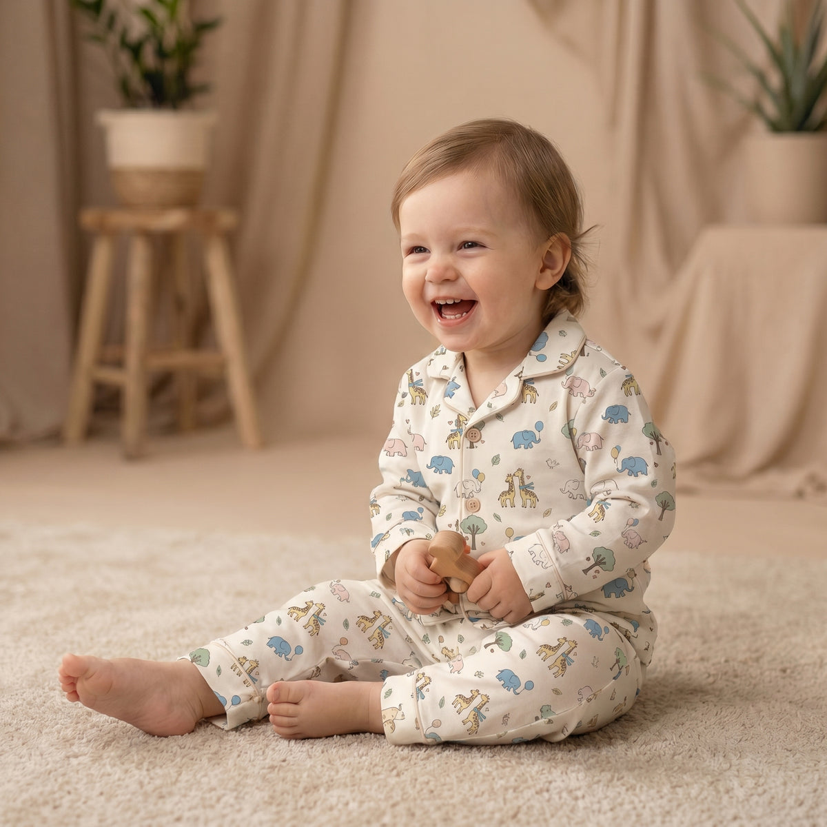 MiniBelly kids' night suit with cartoon elephants, giraffes, balloons, and trees on cream cotton fabric for ages 0-12 months.