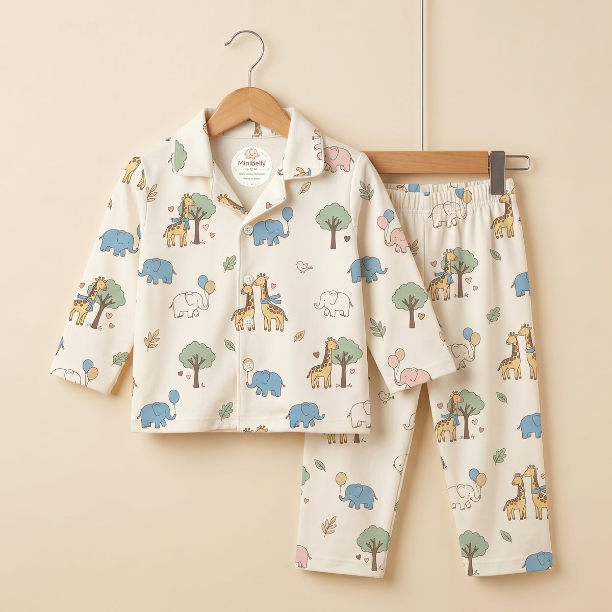 MiniBelly kids' night suit with cute cartoon elephants, giraffes, balloons, and trees in 100% cotton for infants 0-12 months.