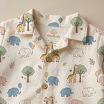 MiniBelly kids' night suit with cute cartoon elephants, giraffes, balloons, and trees on soft cream 100% cotton fabric.